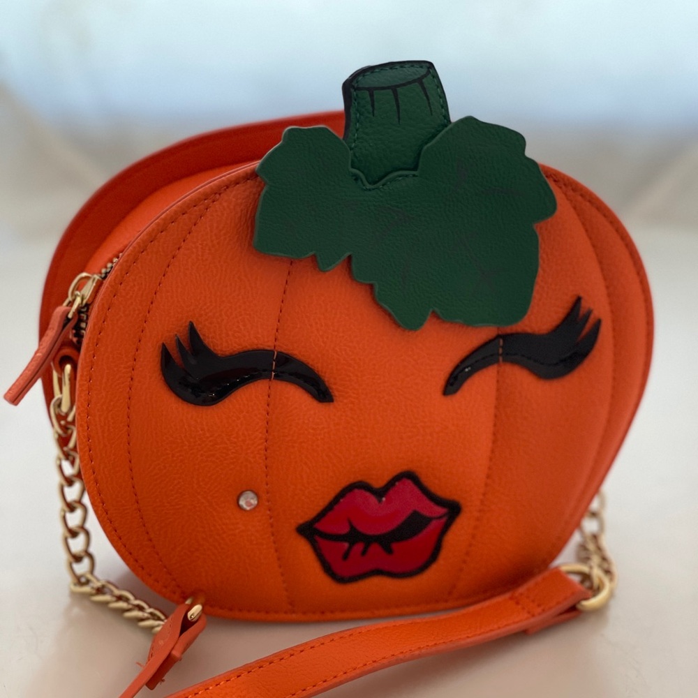 Betsy Johnson pumpkin purse with Monroe rhinestone piercing